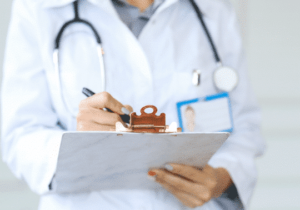 A doctor taking notes 