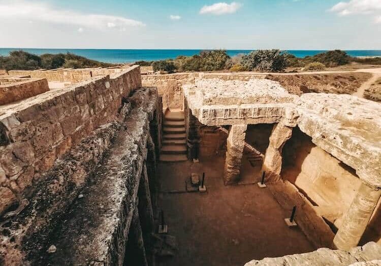 Ancient monuments in Cyprus with the ocean in the background. 