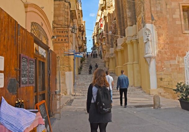 Ancient streets in Malta with tourists walking - Malta as a cryptocurrency friendly country