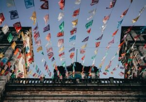 Flags strung up across buildings in Mexico - top places to retire as a foreigner