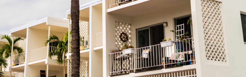 balcony of a white condo building in grenada