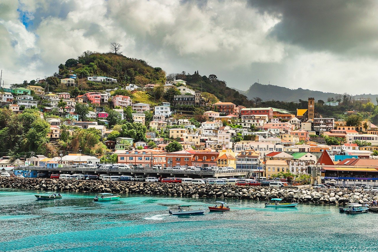 A hill by a beach, covered in houses in Grenada