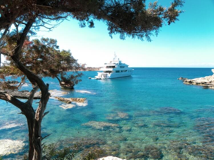A white ship in the middle of the ocean.