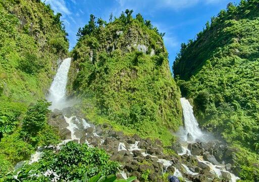 Waterfall ending in the Emerald Pool on the Caribbean island of Dominica - Top immigrant investor programs in Caribbean