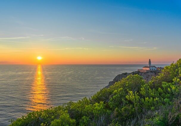 View from a hill overlooking the ocean at sunset in Mallorca, Spain