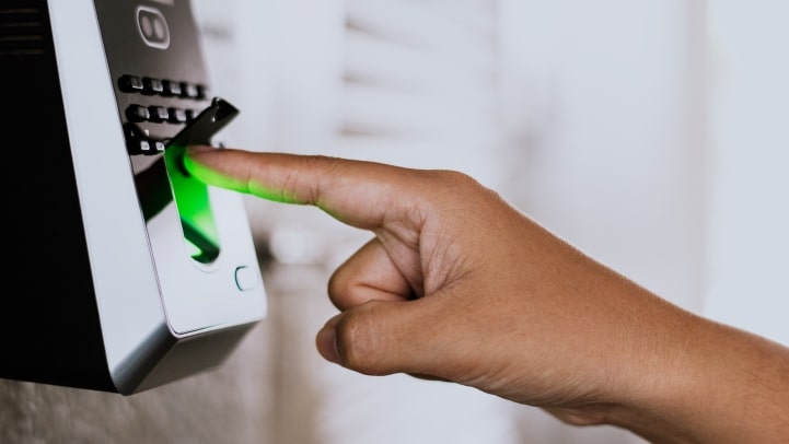 person scanning fingerprint for vanuatu passport biometric requirement