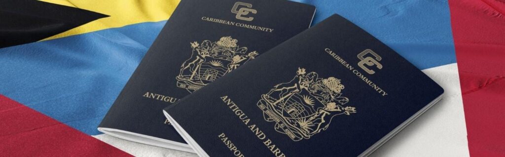 two antiguan and barbudan passport laid down on the antigua and barbuda flag