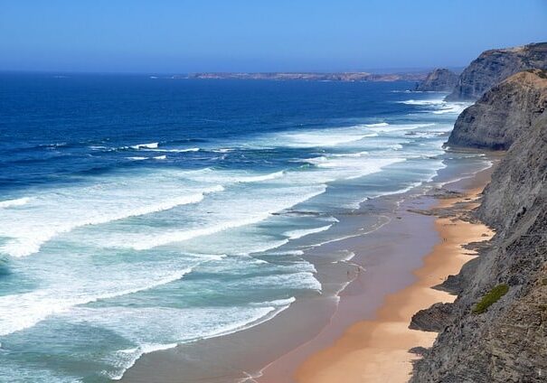 Beautiful coastline view of a beach from a cliff - retirement places for beach lovers