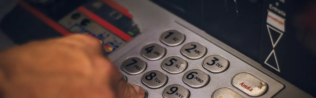 person using an ATM after opening a Bank account