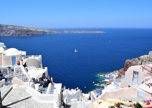 A white coastal village looking over the ocean in Greece. 