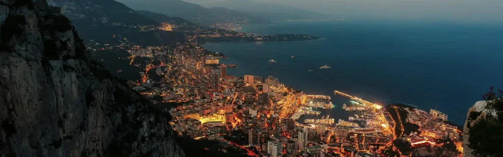 view of Monaco by night - Monaco Carte de Séjour Visa