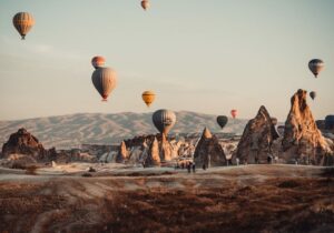 Hot air balloons floating above the Cappadocia region of Turkey 
