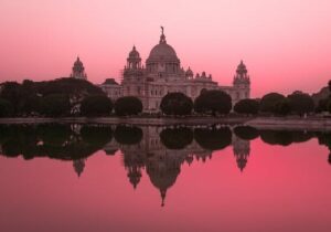 View of Taj Mahal over the river Ganges during a pink sunset - English-speaking countries to move to