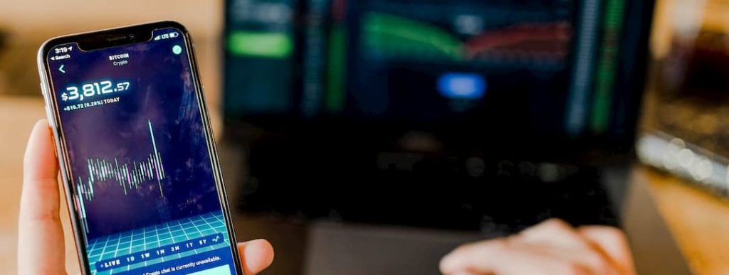 Crypto Market being viewed on the phone - Global Citizen Solutions