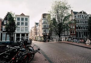 Nieuwezijds Voorburgwal street in Amsterdam, Netherlands - best European cities to live in