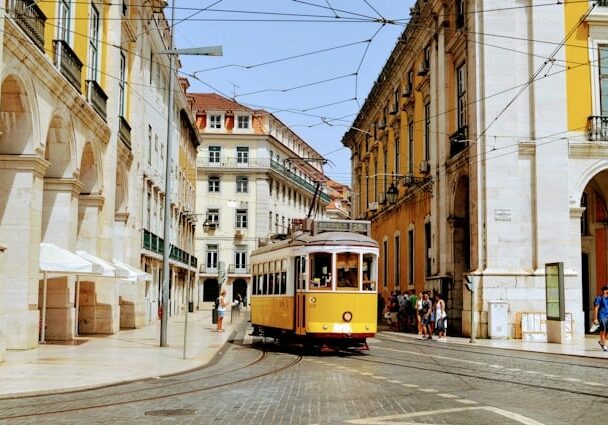 Iconic "Yellows of the Rails" trams, operated by the Carris public transportation company, in Lisbon, Portugal - easy European citizenship