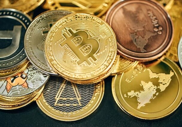 Various Bitcoin coins stacked on top of each other - 10 cryptocurrency types