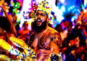 a masquerader dancing in traditional outfit at Creole Day in st lucia