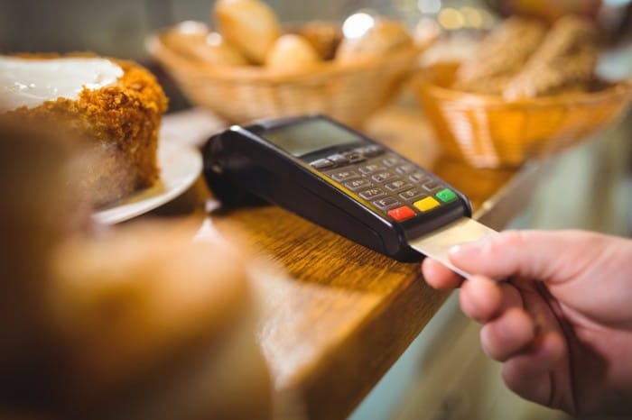 gold st kitts bank account card inserted in payment machine