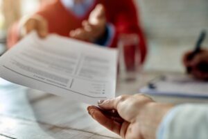 woman handing in important documents