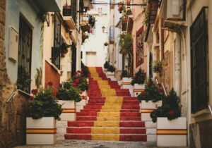 Famous steps in Spain painted in the red and yellow colors of the Spanish flag - Spain Golden Visa program