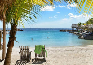 View of beach chair at LionsDive Beach Resort in Curacao - easy Dutch Caribbean country to get citizenship in