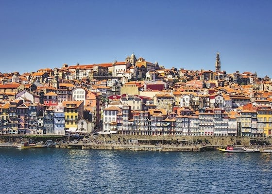 View of the vast Lisbon in Portugal from the ocean with a pier and boats - safest European country