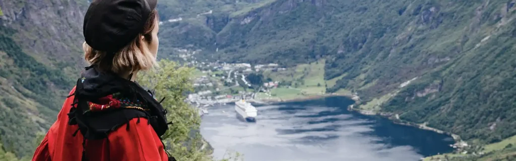 woman looking at one of the norwegian fjords