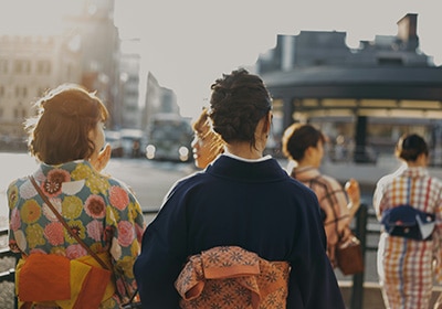 View of woman walking in Japan while wearing colorful traditional garments - safest Asian countries for women