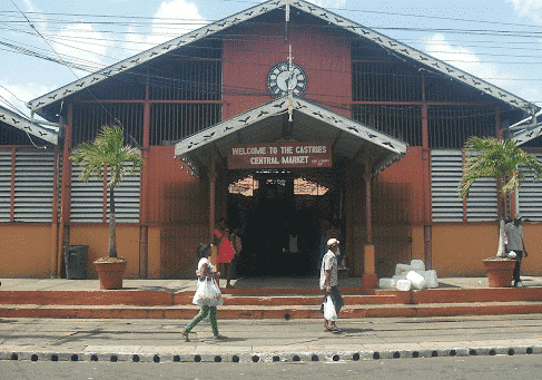 outside view of Castries Market in st lucia and two people walking past