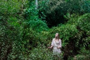 a woman touring Diamond Falls Botanical Gardens in st lucia