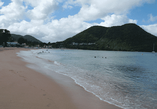 view of the bay and people swimming on reduit beach in St Lucia