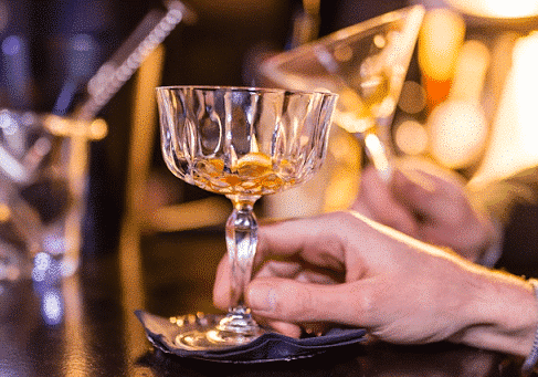 two people holding rum glasses on a St Lucia Distillers rum tour