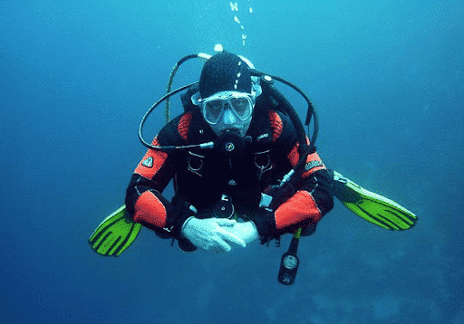 a man scubadiving off sugar beach in st lucia