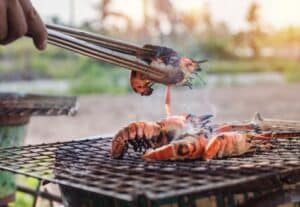 fried shrimp on bbq grill at Anse La Raye Friday Night Fish Fry in st lucia