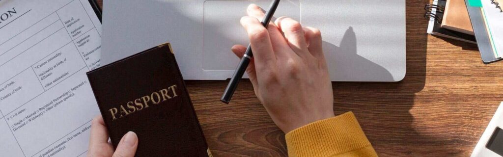 person filling out application to apply for an antigua and barbuda visa