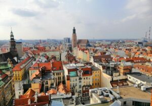 Vertical shot of Wroclaw city center, Poland with beautiful buildings under the blue sky - easiest countries to get citizenship