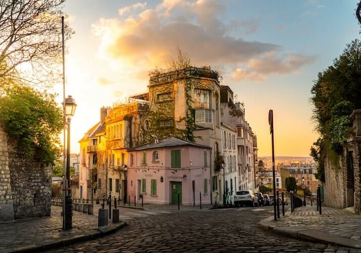 Old-fashioned building on a corner in Paris, France at sunset - inheritance tax laws in France