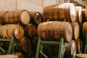 rum barrels stacked up at a distillery in antigua and barbuda
