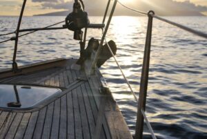 a yacht sailing in the sunset
