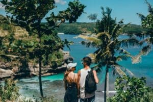 couple walking to a beach in antigua