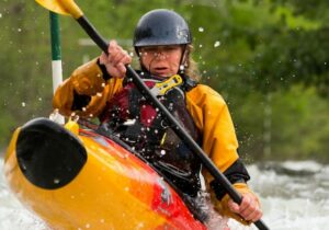 a kayaker paddling on a yellow kayak in North Sound Marine Park. antigua
