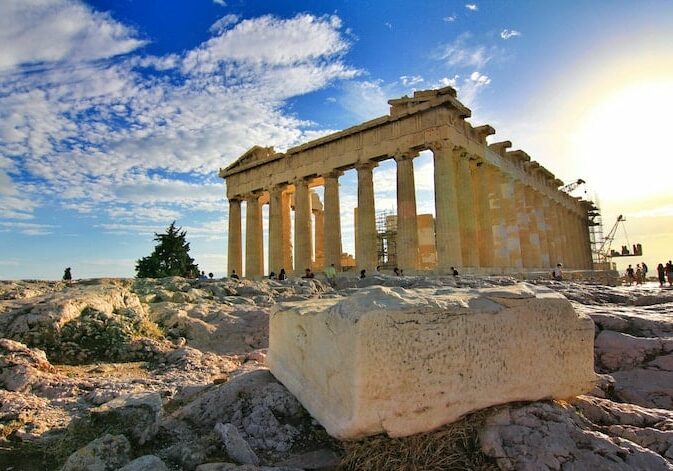 A destroyed monument in Greece with pillars. 