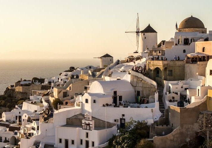 A coastal village with while houses in Greece overlooking the sea. 