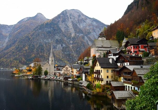 Quaint town in Austria on a lake with mountains in the background - European countries that are safest
