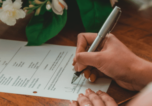 A person signing a document 