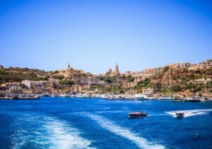 Boats speeding on water in Malta - easy country to immigrate to