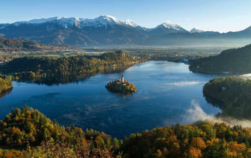 Church on a lake in the mountains in Bled, Slovenia - retirement countries for Americans