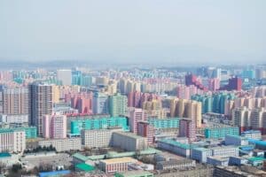 The flats of Pyongyang, as photographed from the Juche Tower in North Korea - weak passport with low mobility