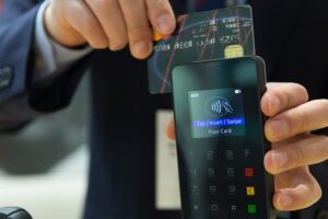 man making a payment with a bank card in Portugal